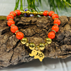 Gold Stretchy Beaded Bracelet With Charm